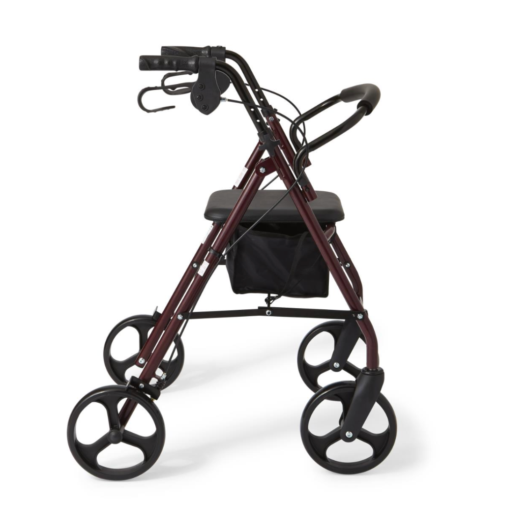 The Medline Basic Lightweight Steel Folding Rollator, in vibrant red with four black wheels and handlebars, includes a storage pouch beneath the seat. Height-adjustable and elegant, it is positioned against a plain white background for a functional appearance.